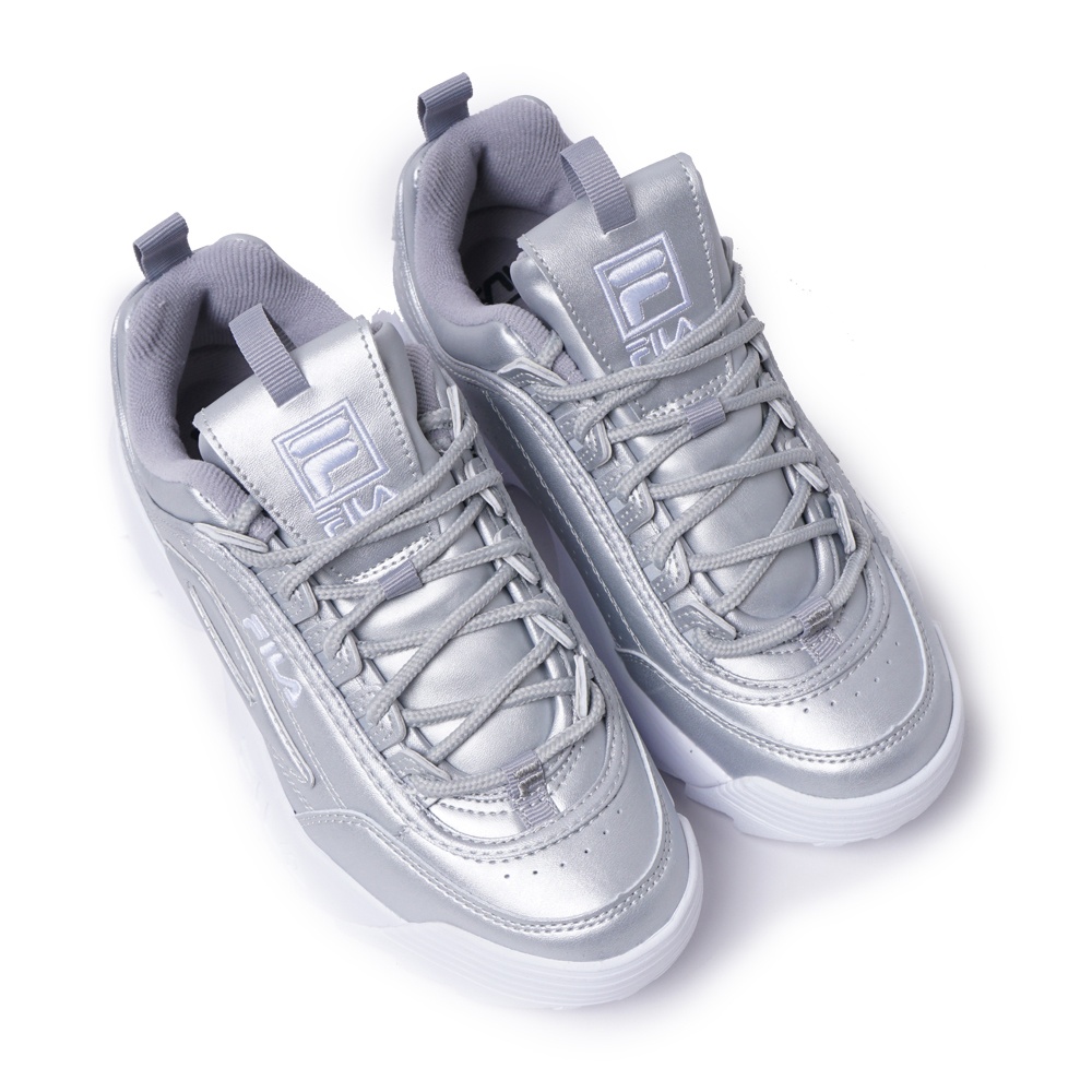 Metallic fila disruptor outlet
