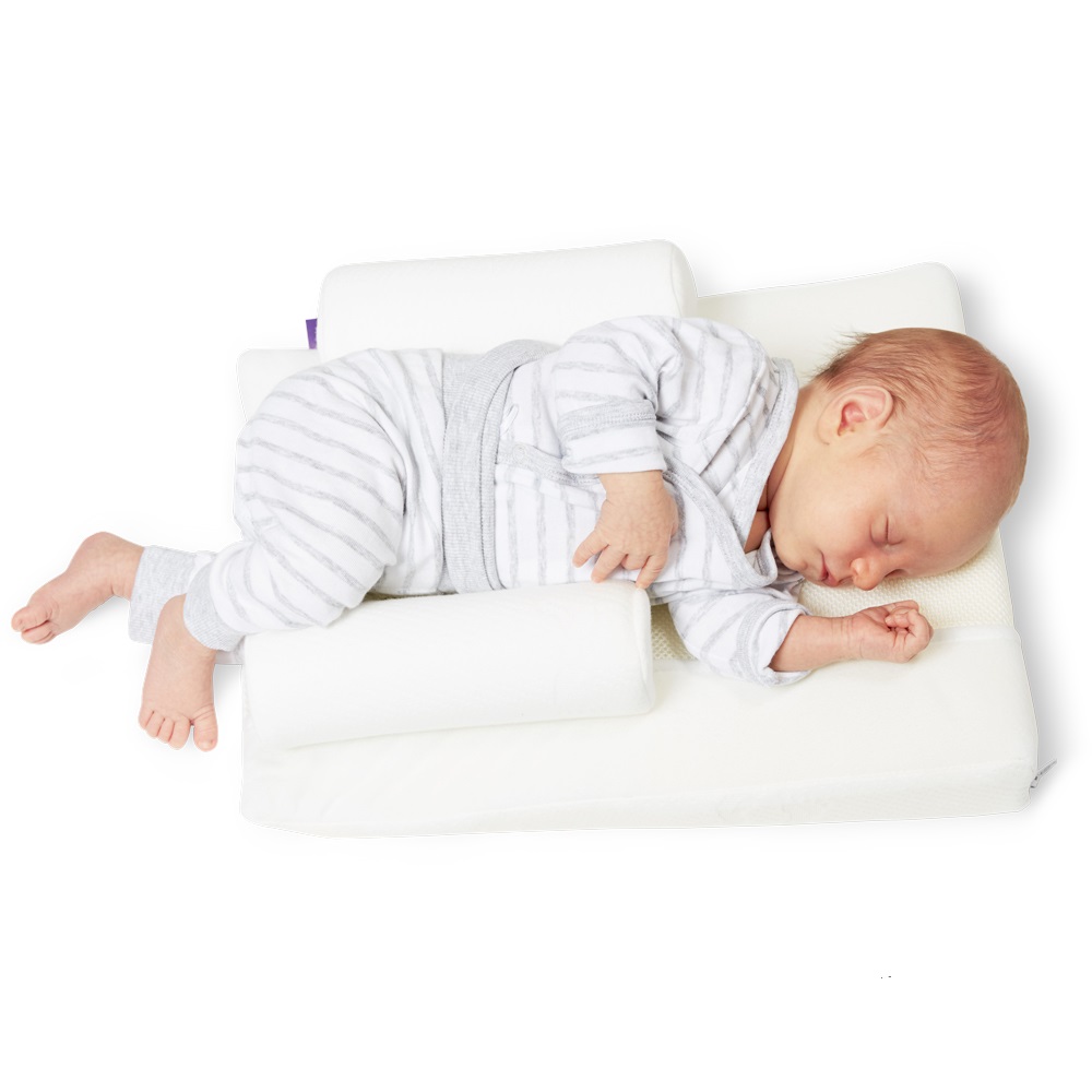 Какую подушку купить ребенку. Traumeland подушка Visco 32 x 40 см.0-8 мес.. Traumeland позиционер для сна. Ортопедическая подушка для младенцев. Подушка позиционер для новорожденных.
