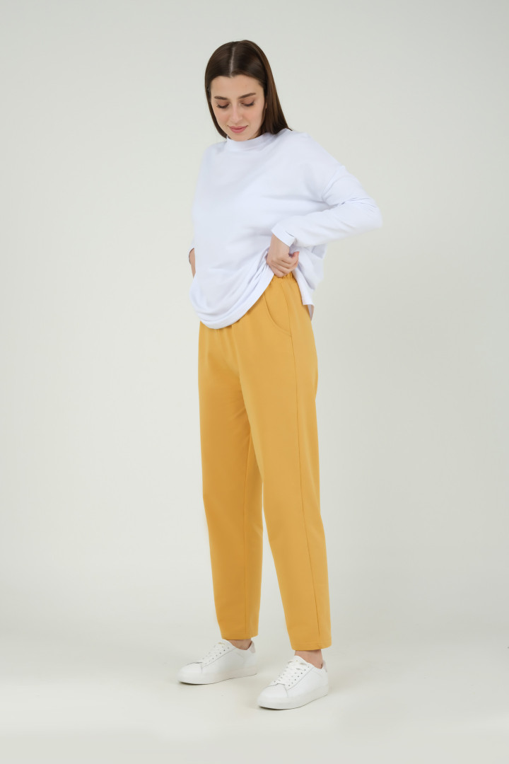 

Спортивные брюки женские HE-QA T3105 желтые 38 (товары доставляются из-за рубежа), T3105