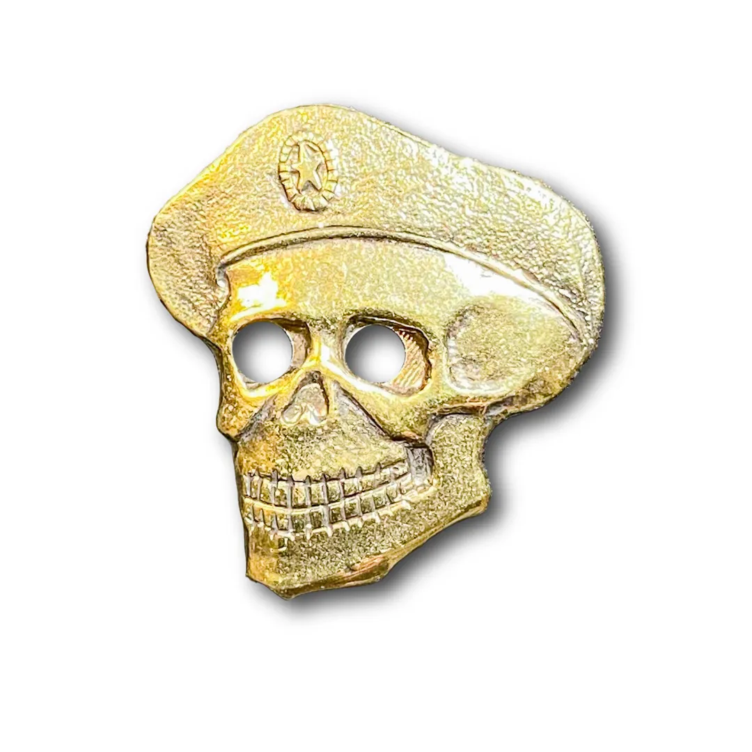 

Знак ATRIBUTICA Череп В Берете Золотистый Пимса