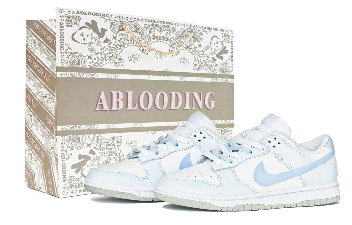 

Кеды унисекс Nike Dunk Low ABLOODING белые 44.5 EU, Белый, Dunk Low ABLOODING