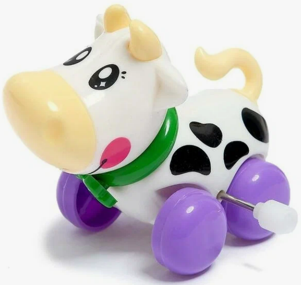 Развивающая игрушка 1000toys Заводная корова с бантиком