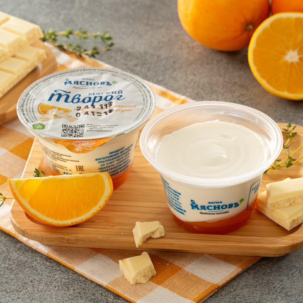 Творог мягкий двухслойный МясновЪ ФЕРМА с кусочками апельсина и белым шоколадом 7% 150 г