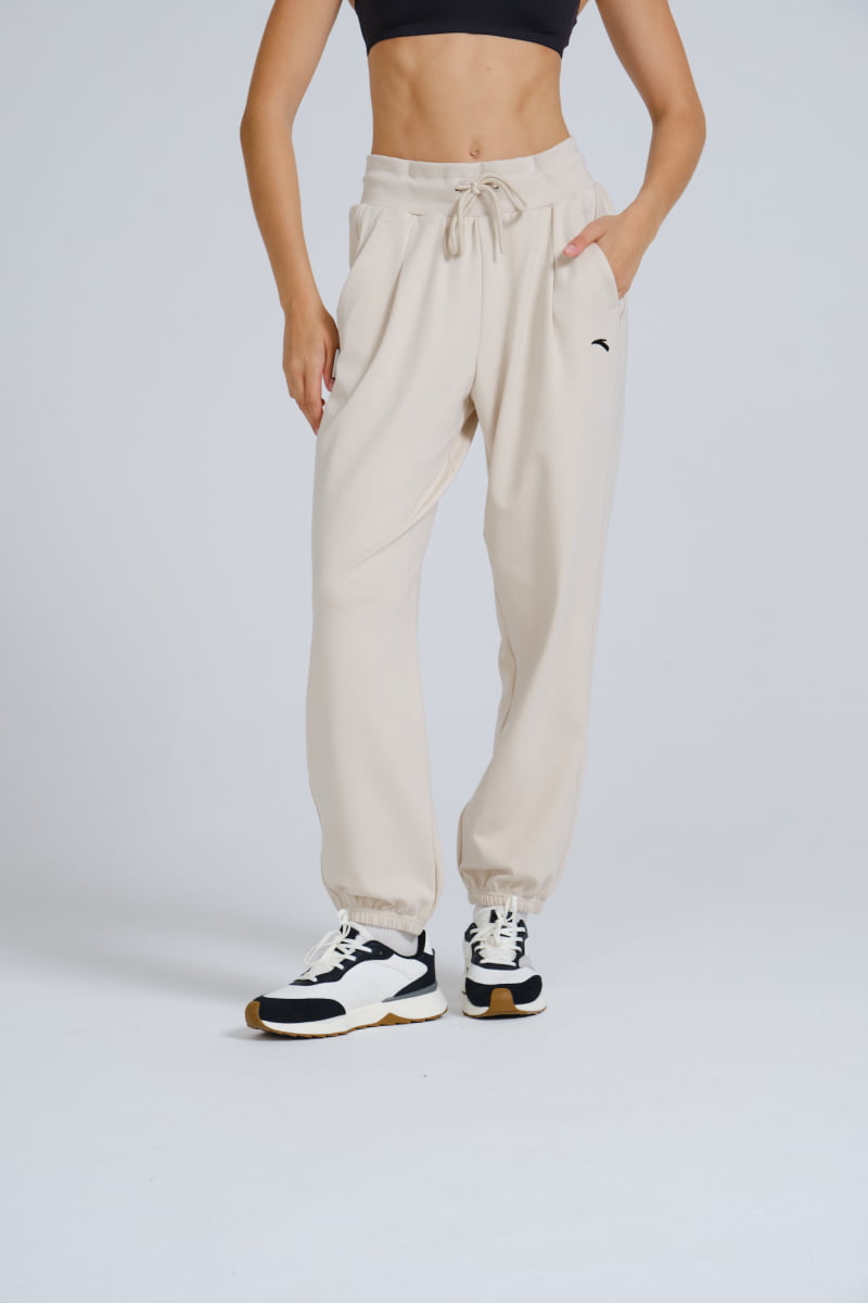 Спортивные брюки женские Anta Dance Ecocozy/ANTIBACTERIAL 862338320 бежевые S