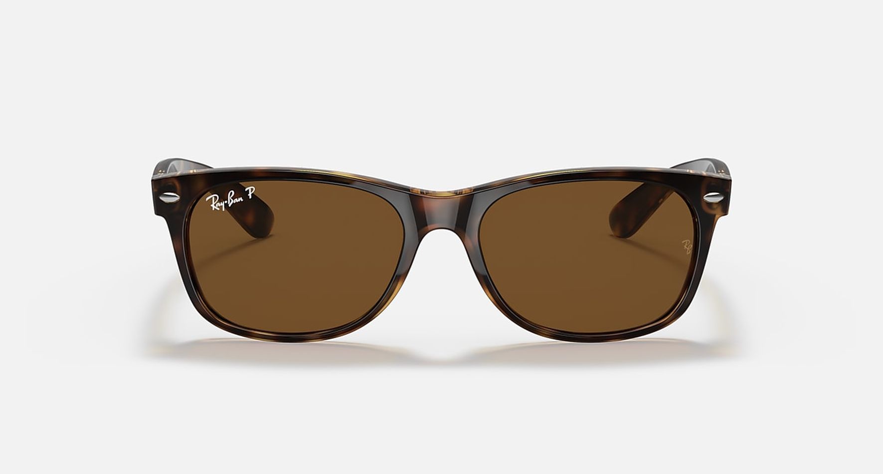 

Солнцезащитные очки унисекс Ray-Ban RB2132 коричневые1, RB2132