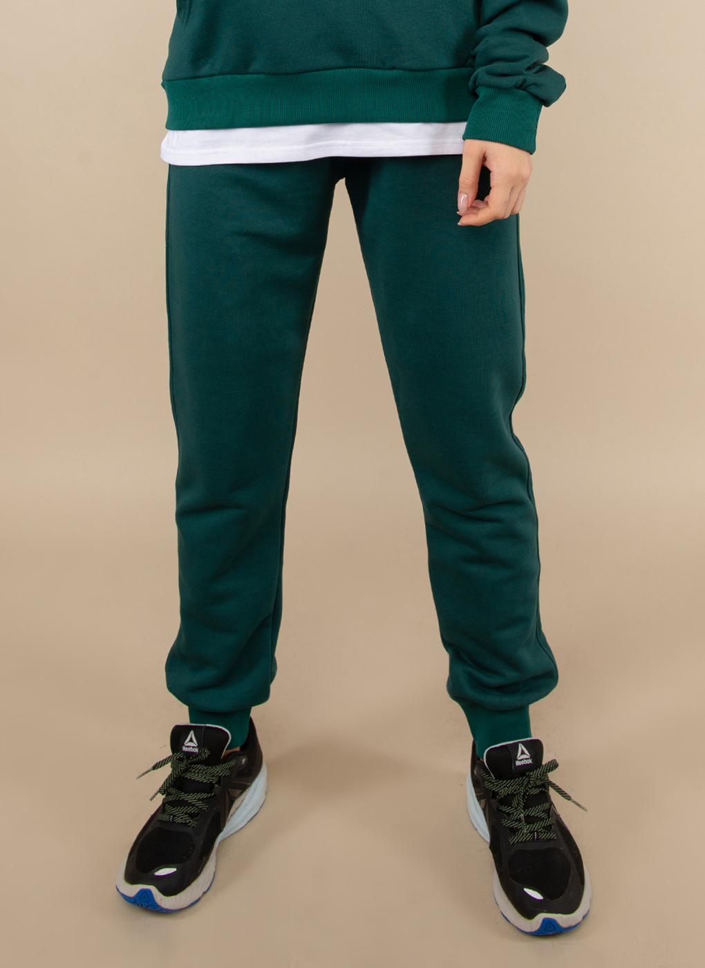 фото Спортивные брюки женские каляев 1622269 зеленые 40-42 ru
