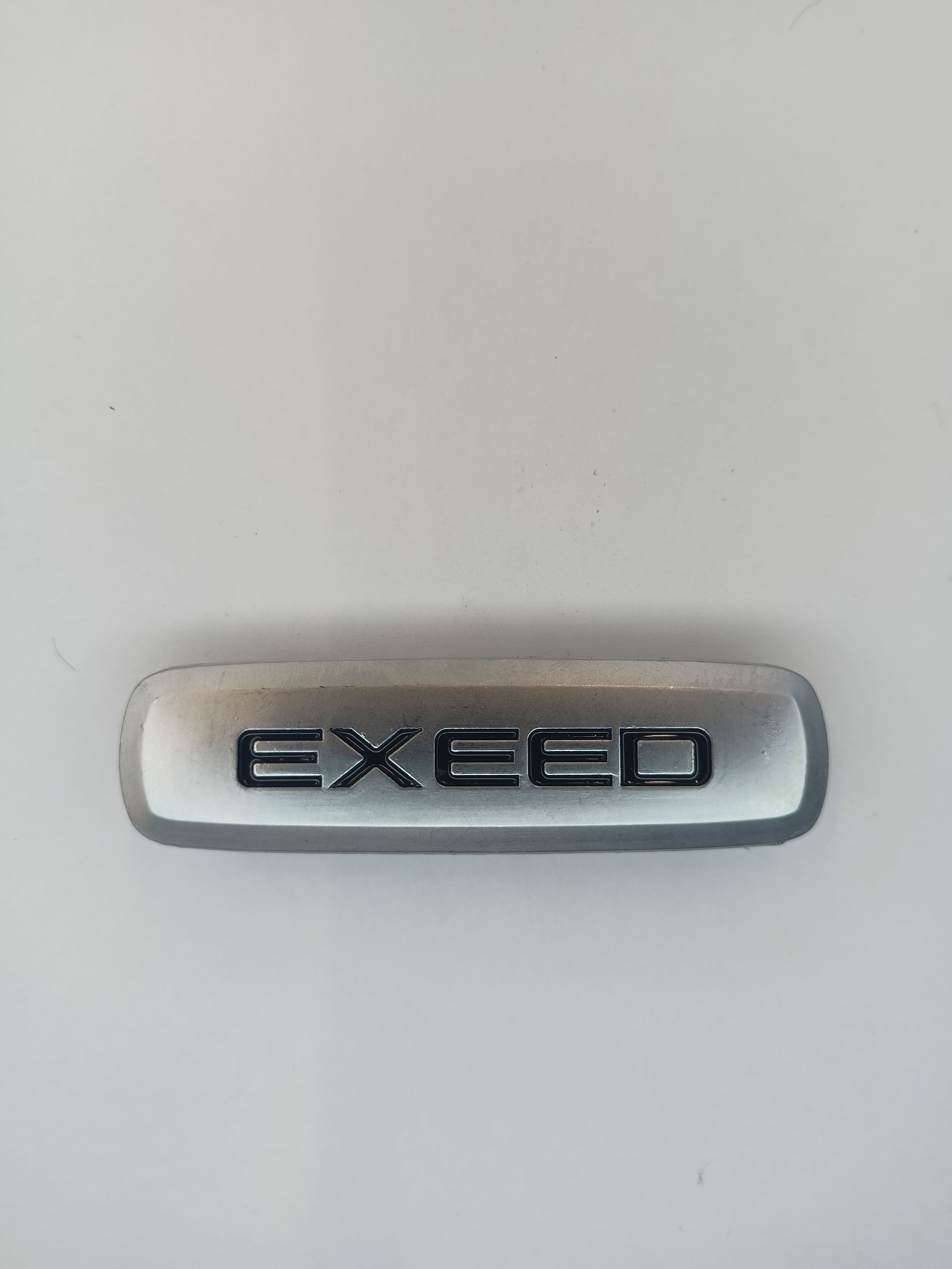 

Логотип с маркой автомобиля для ЭВА ковриков EXEED