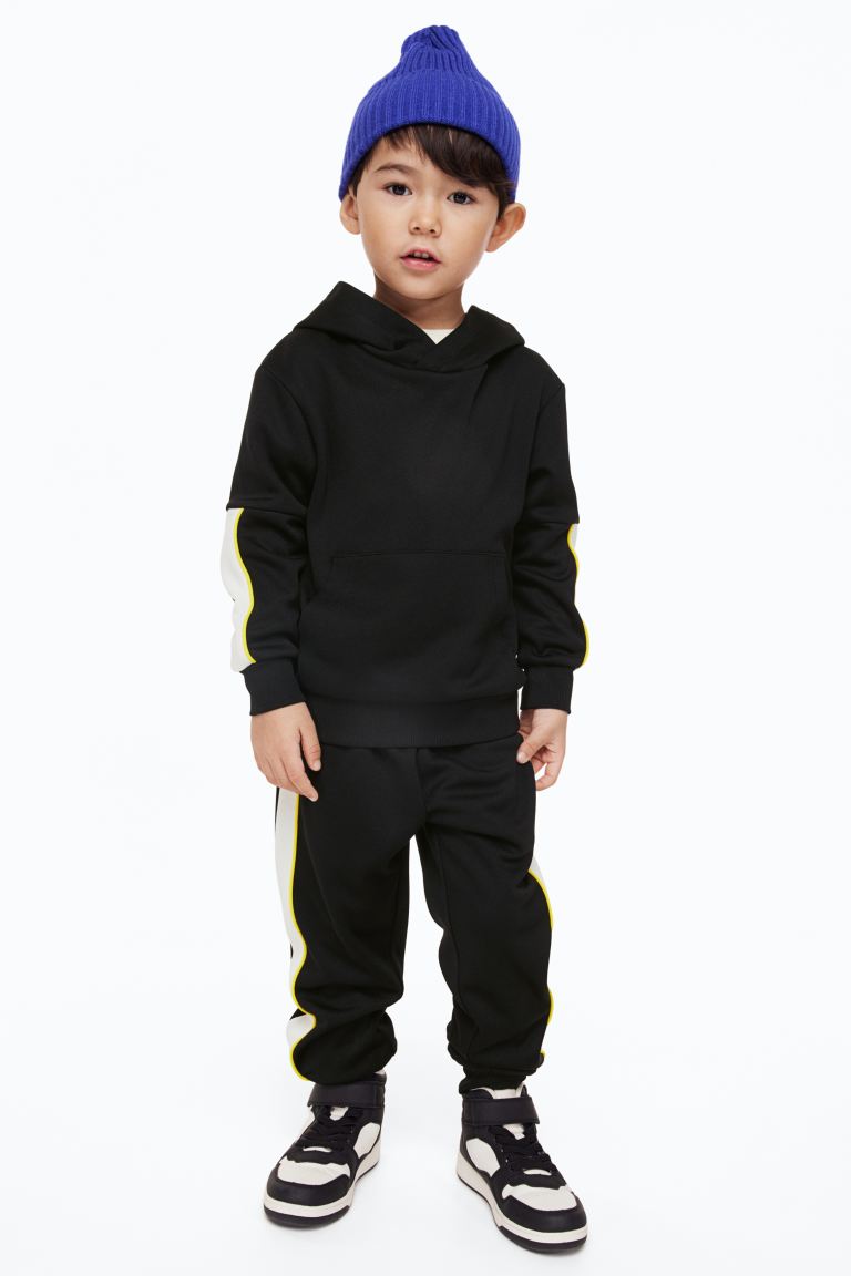 Костюм детский H&M 1144045, цвет черный/разноцветный, размер 116 (доставка из-за рубежа)