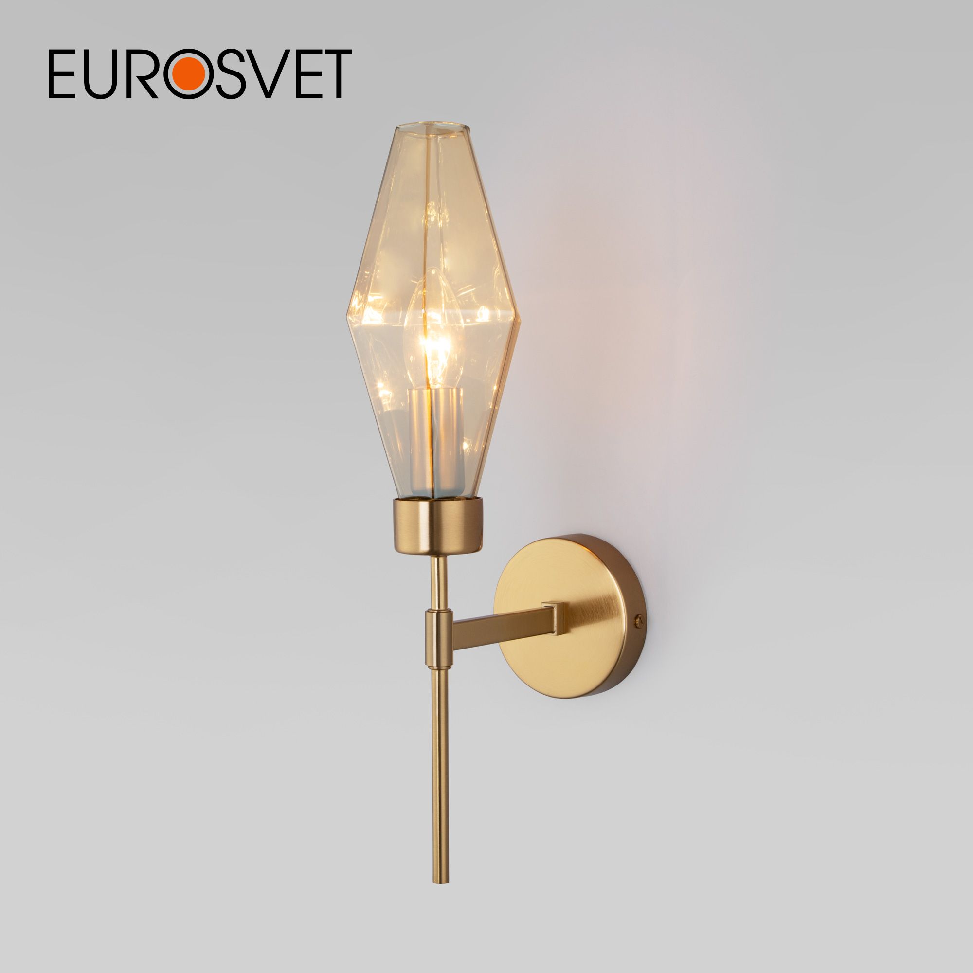 

Настенный светильник Eurosvet Prism 60143/1 латунь с янтарным стеклянным плафоном Е14