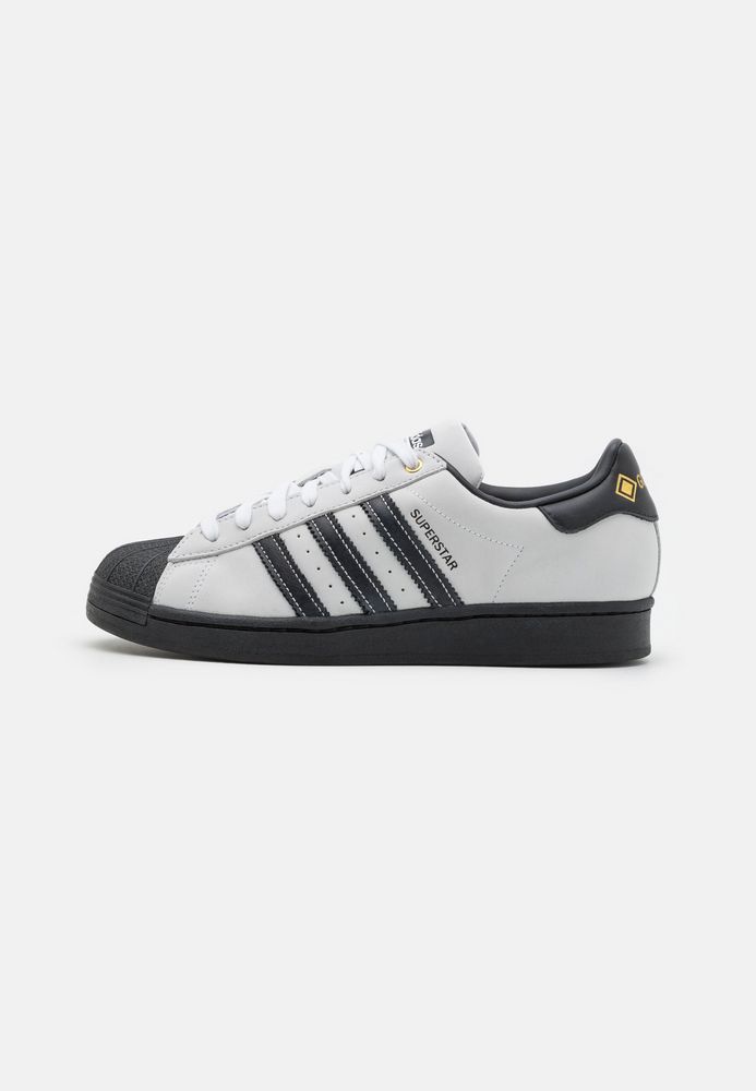 

Кеды унисекс Adidas Originals AD115O1NC белые 43 1/3 EU, Белый, AD115O1NC