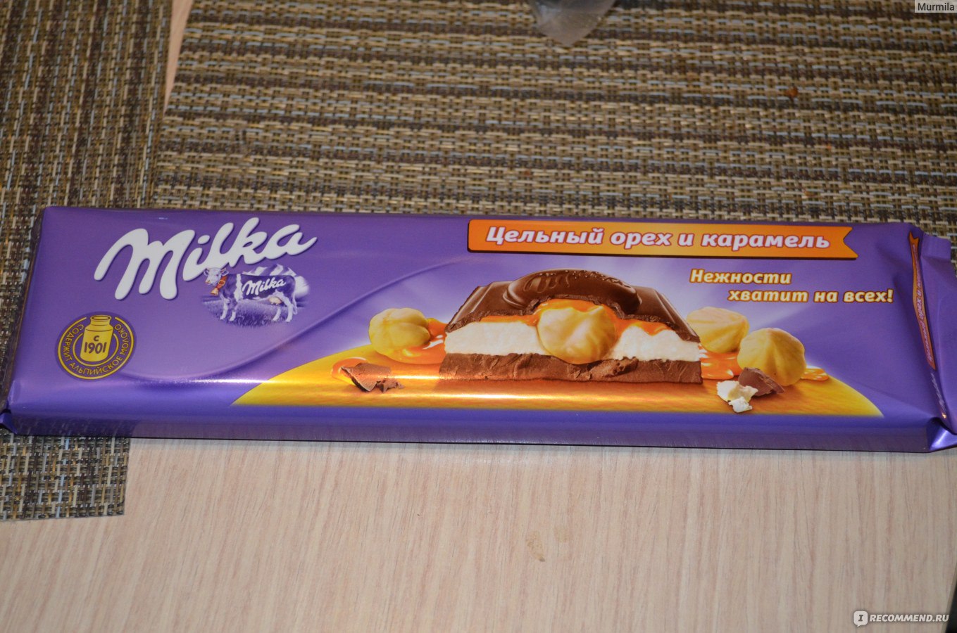 Milka шоколад с карамелью и орехами